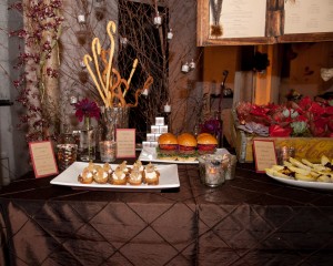 Appetizer Table set with mini elk burgets and curly bread sticks.