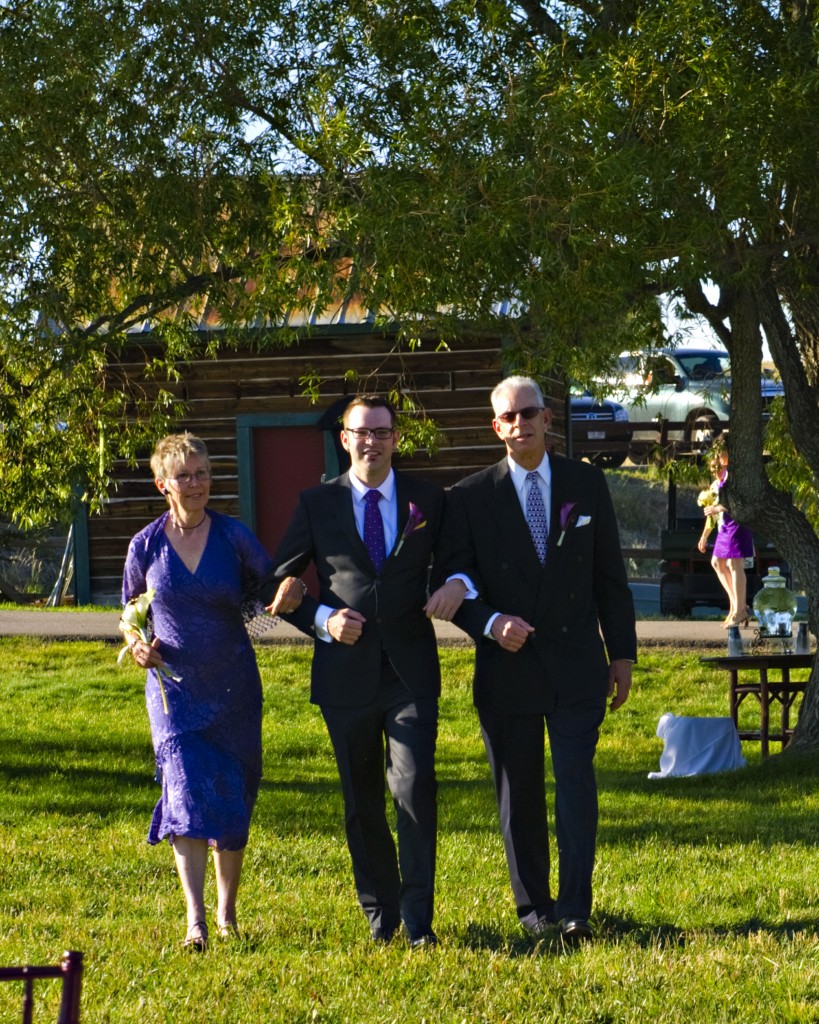 Groom and Parents walking down the aisle